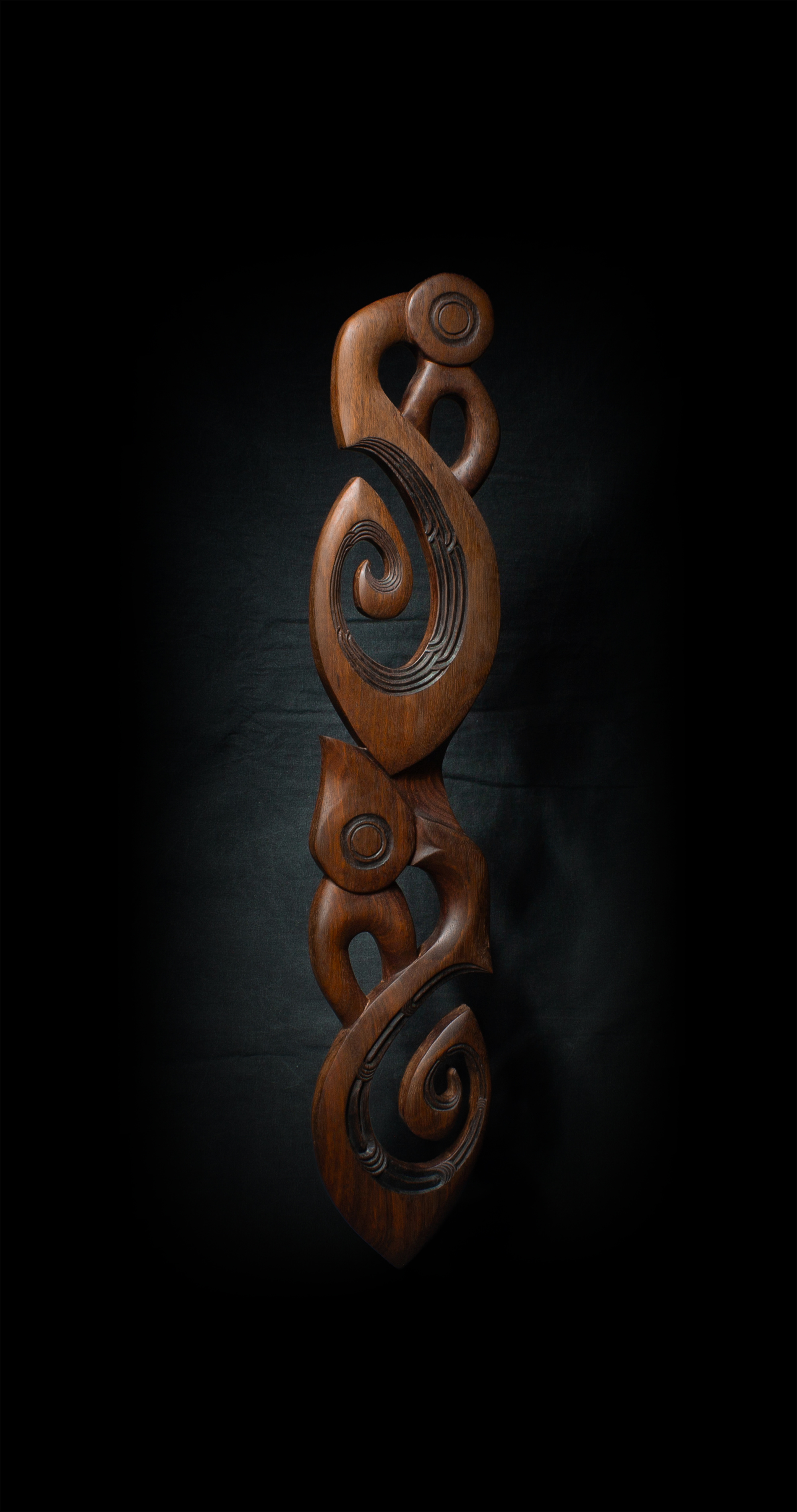 Artwork: Rua Manaia, a tall wooden carving.